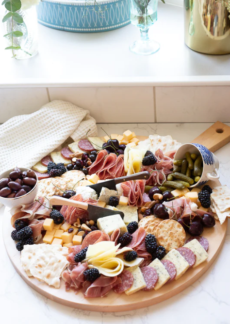 The Handcrafted Round Serving Board with Handle
