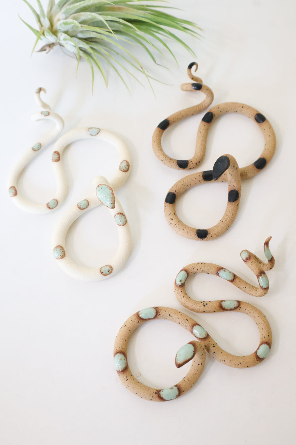 Three Small Ceramic Wall Snakes