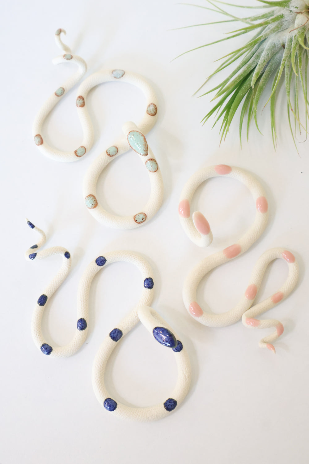 Three Small Ceramic Wall Snakes