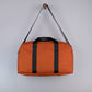 Bryant Medium Duffle Bag in Rust + Black