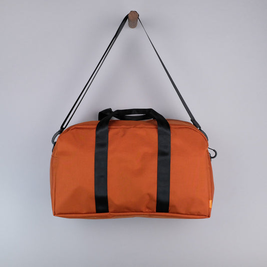 Bryant Medium Duffle Bag in Rust + Black