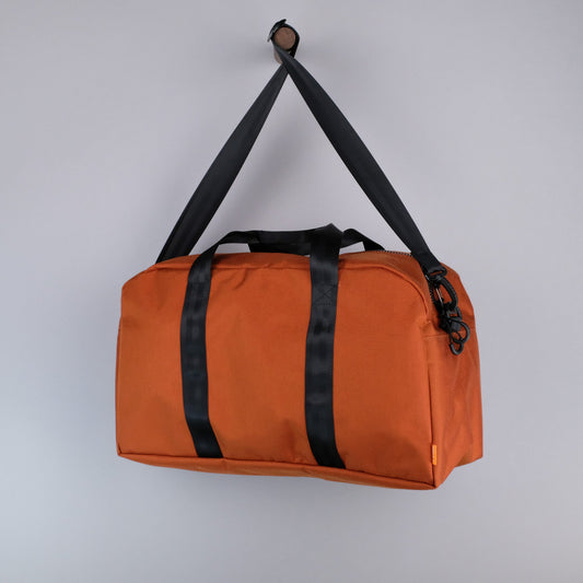 Bryant Medium Duffle Bag in Rust + Black